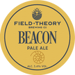 Round label for Field Theory Brewing Co. Beacon Pale Ale with yellow background and black text.